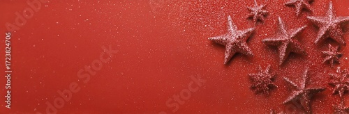 Festive Red Background With Decorative Stars and Pinecones for Holiday Celebr...