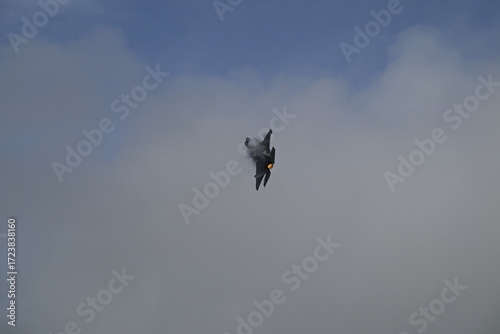 Jet hitting afterburners vapor trail
