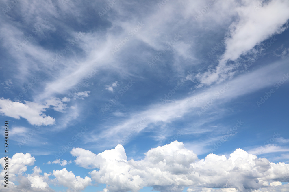 Obraz premium blue sky background with tall white clouds ideal for nature and clean air concept