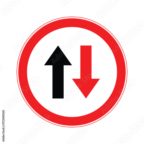Priority road sign with black upward arrow and red downward arrow.