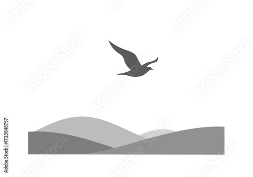Bird Soaring Over Majestic Rolling Hills.