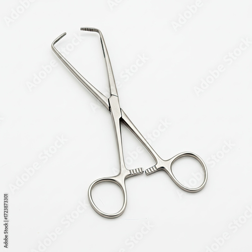 surgical forceps on white background