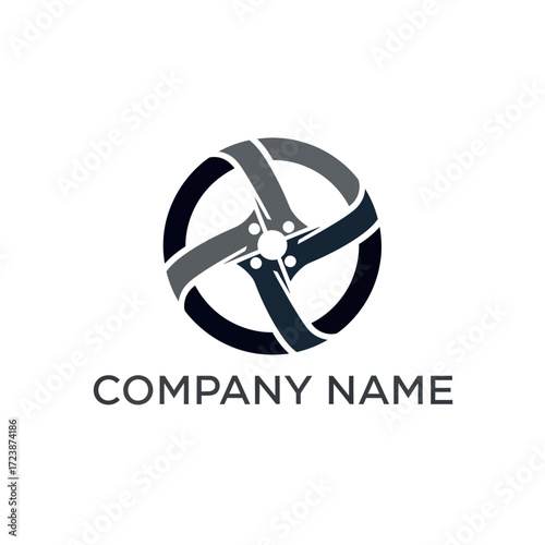 Modern abstract car wheel rim logo design in black and grey for automotive business branding.