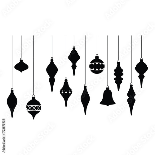 Collection of diverse black christmas ornaments hanging on threads forming a festive holiday display