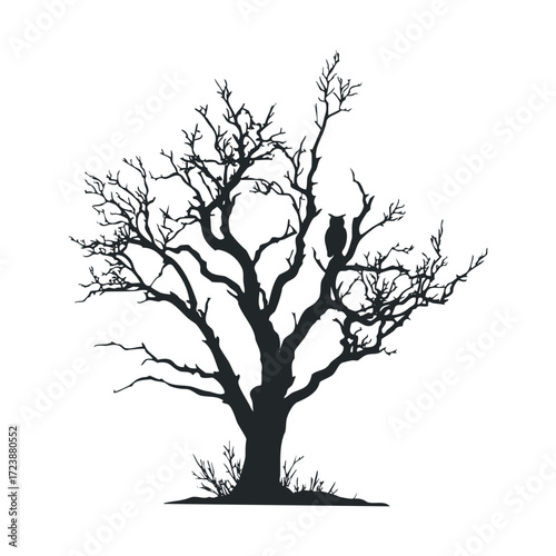 Silhouette of a dead tree with an owl perched on a branch.