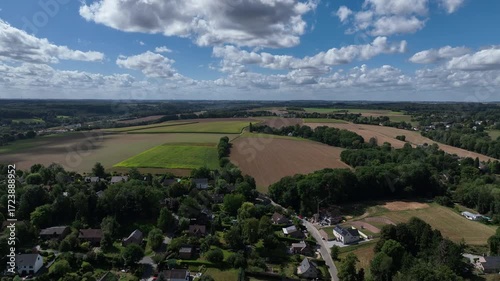 Aerial view of Genappe municipality and city of Wallonia located in the Belgian province of Walloon Brabant. Villas with garden surrounded by forest.