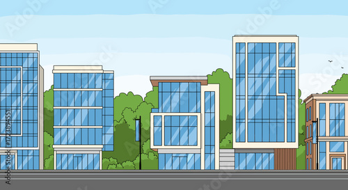 A row of modern glass buildings stands against a backdrop of lush green trees and a clear blue sky.