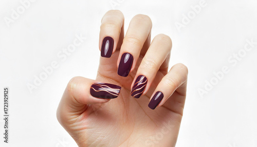 Elegant woman hand with dark purple nail polish and artistic design  