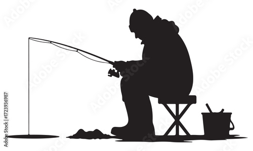 Silhouette of Person Ice Fishing in Winter