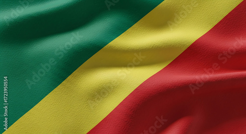 An eyelevel closeup captures the national flag of the republic of the congo, showcasing its vibrant green, yellow, and red diagonal bands, creating a visually striking representation of the nations id