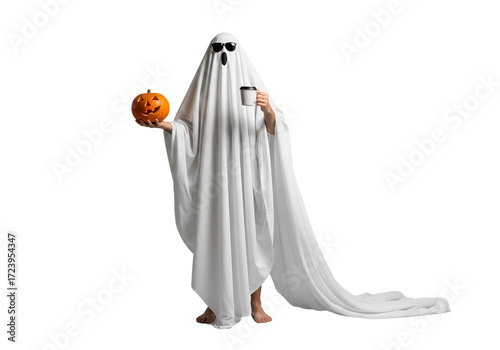 A man standing in a ghost costume made from a sheet with a pumpkin and coffee in sunglasses on an isolated background. Halloween celebration concept.