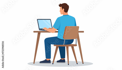 Man sitting at desk, working on a laptop with a blank screen, viewed from behind.