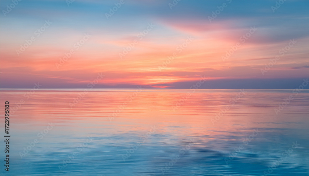 Obraz premium Pastel Sunrise Over A Calm Reflective Sea Soft Blurred Horizon With Iridescent Hues Of Pink Orange And Teal