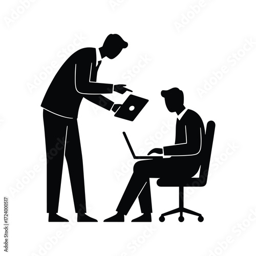 Business meeting silhouette of two men one standing and pointing at laptop screen