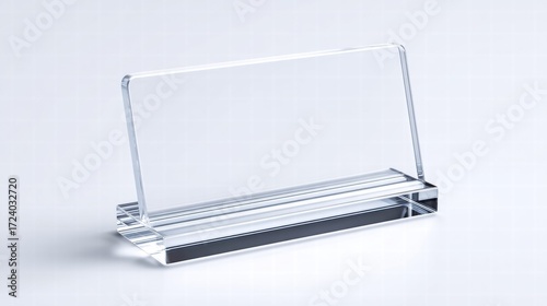Elegant clear acrylic nameplate on a white surface.