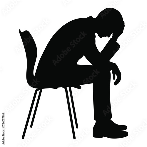Black and white silhouette of a person sitting on a modern chair in deep thought or despair, wearing formal business attire