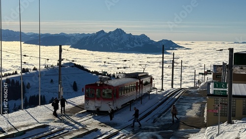Rigi-Kulm, Switzerland - November 29, 2024: Vitznau-Rigi mountain railway at the Rigi-Kulm terminus on the summit in the snowy winter landscape.