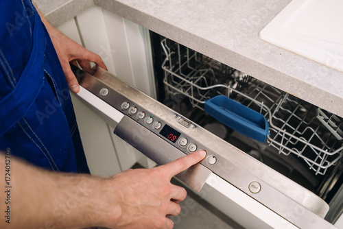 Repairing a broken dishwasher during regular home maintenance service