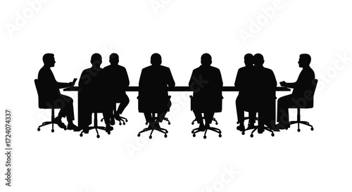 Group of people sitting around a table in dark silhouette