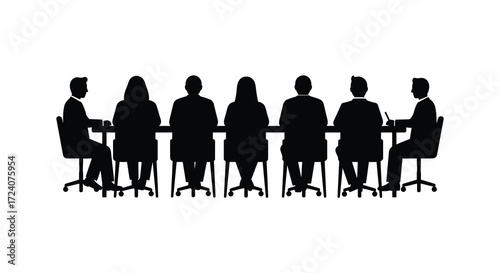 Group of people seated around a table in dark silhouette