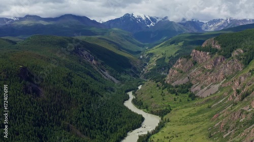 Aerial view of the mountain river between the mountains