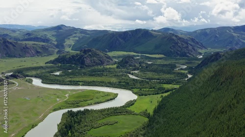 Aerial view of the mountain river between the mountains