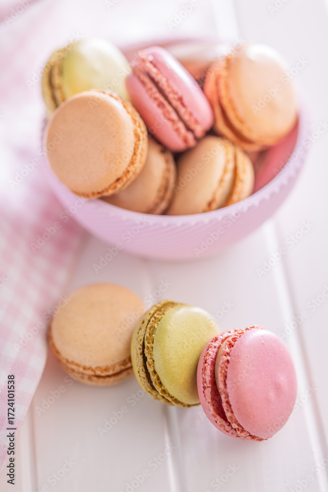 Fototapeta premium Different flavors of macarons. Colourful macaroons on white table.