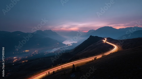 Winding road at twilight, mountain vista