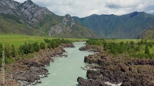 Aerial view of the mountain river between the rocks