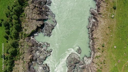 Top view of the mountain river between the rocks in summer