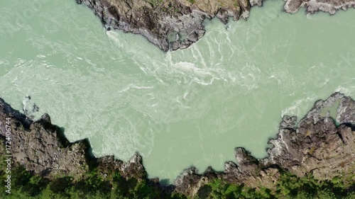 Top view of the mountain river between the rocks in summer