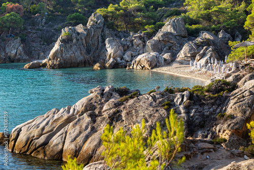 Golden morning light over Kavourotripes Paradise Beach, Sithonia, Chalkidiki, Greece