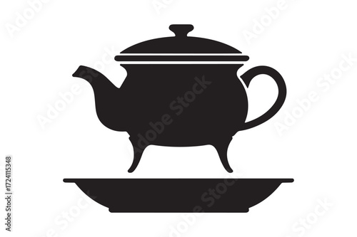 Silhouette of a vintage teapot on a saucer