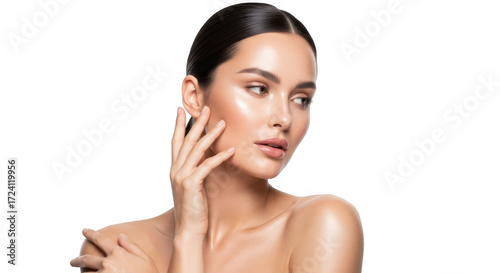 A woman with glowing, radiant skin and dark hair, posing with her hand on her face, isolated on white isolated on transparent background