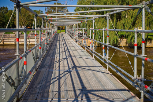 Canvastavla Scaffolding Walkway Crossing Urban River