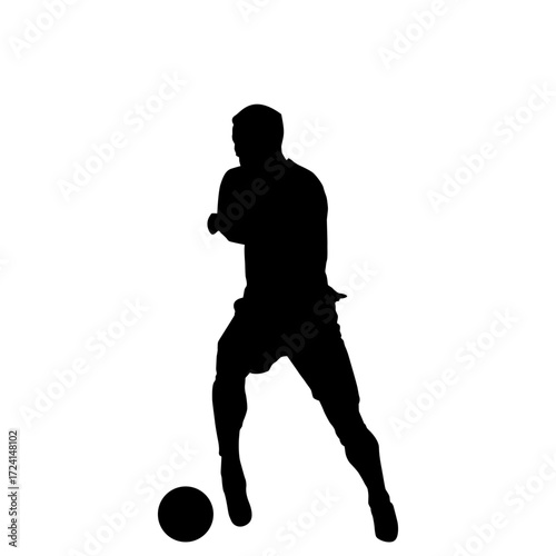 A powerful silhouette of a soccer player in mid-action, dribbling a ball.