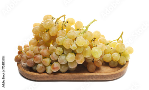 Fresh white grapes in wooden bowl isolated on background, side view	