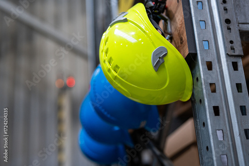Safety training - head protection - helmet in a high-bay warehouse