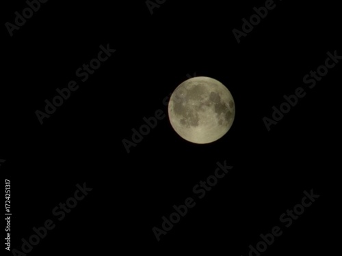 Full moon against the black night sky. Full moon background isolated on black