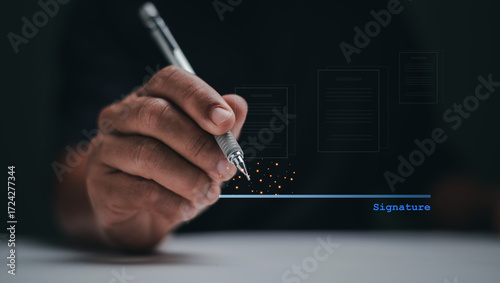 Digital Signature concept. Businessman holding pen about to sign on digital contract line. Symbolizing legal agreement, authorization and professional approval in business or official documentation.