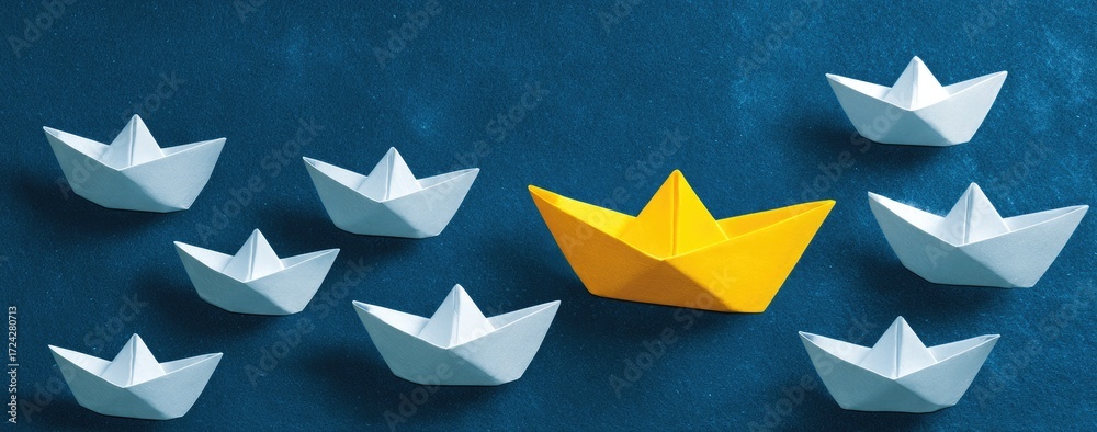 Obraz premium Paper boats, different color, leadership concept