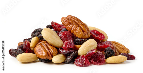 Mix of nuts and dry fruits isolated on a white background, almonds, walnuts, hazelnuts and raisins on a pile, healthy food