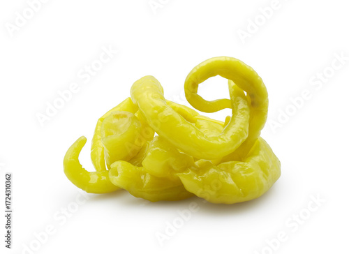 Pickled green thin wrinkled long peppers isolated on white background