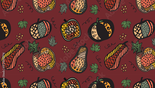 Seamless pattern with colorful pumpkins on a bard background in doodle style