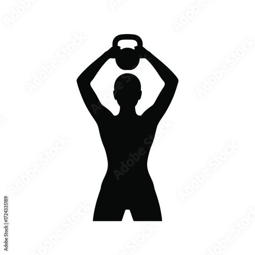 Silhouette of a person holding a kettlebell overhead