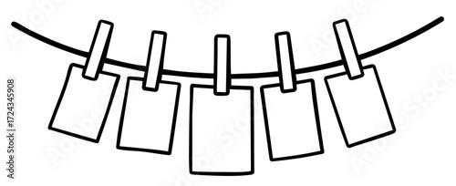 Cards or photos hanging on clothesline with clothespins, decorative display for memories, notes