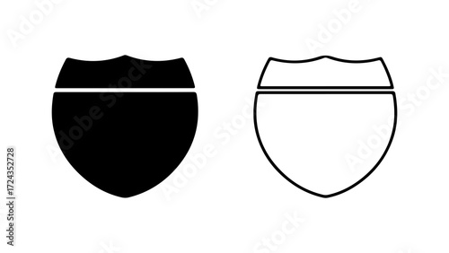 Two highway shield signs one black and one outline on white background.