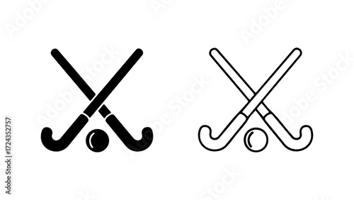 Two hockey sticks crossed with a hockey ball in the middle in black and white.