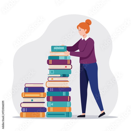 Woman stacking colorful books in two tall piles on light grey background