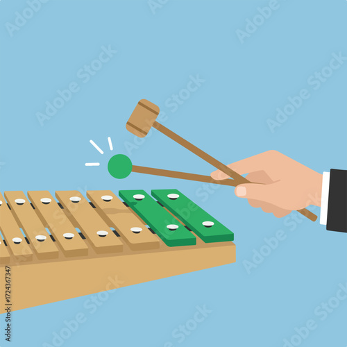 Cartoon illustration of xylophone being played on pale blue background